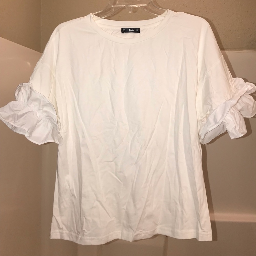 White ruffle shirt